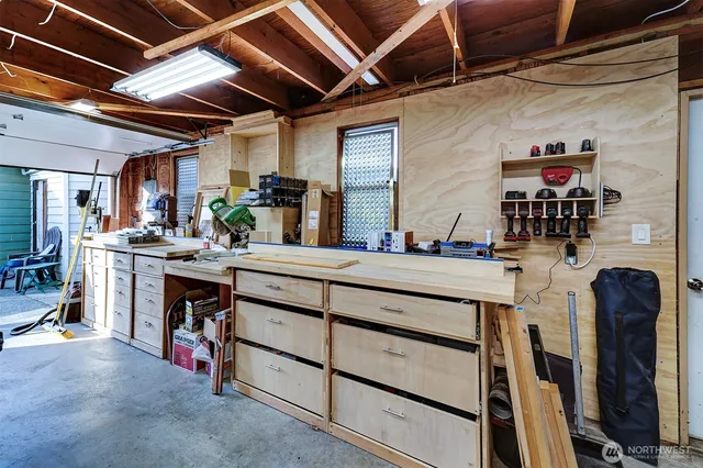 a room with gym equipment and racks
