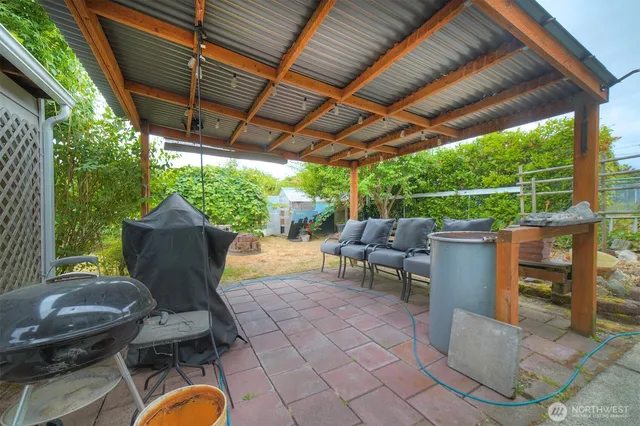 a house view with a sitting space and garden