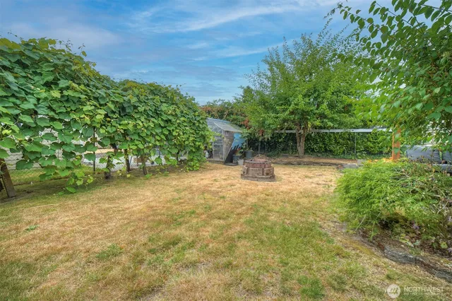 a backyard of a house with lots of green space
