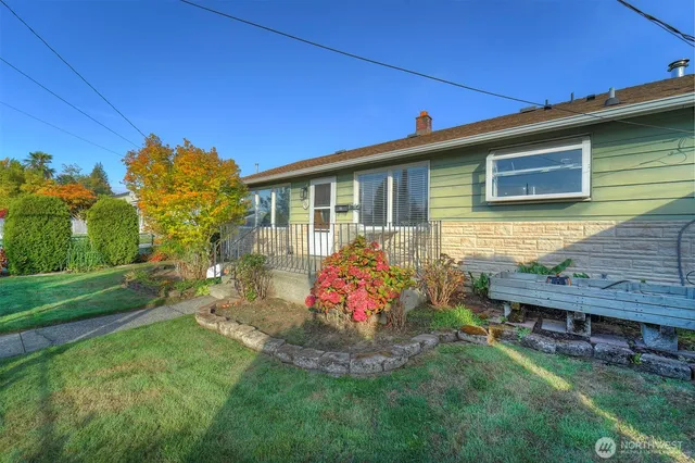 a front view of a house with garden