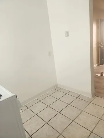 a bathroom with a granite countertop sink a mirror and a shower
