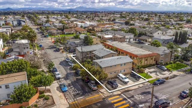 an aerial view of residential houses with outdoor space