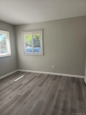 a kitchen with white cabinets and a stove