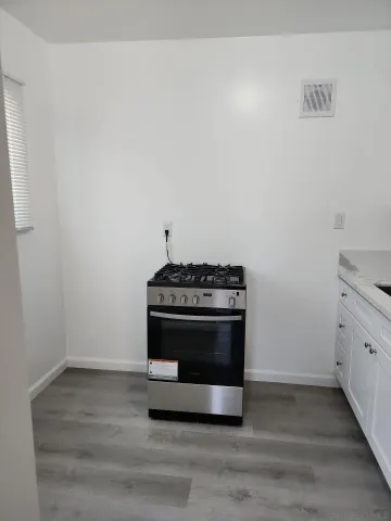 a bathroom with a shower and a sink