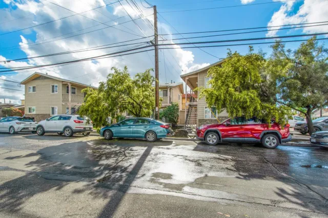 a view of a cars in front of a house