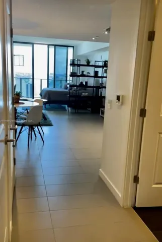 a bedroom with furniture and white walls