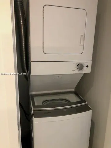 a view of a balcony with chairs and a table