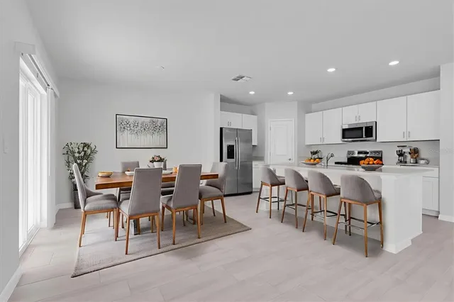 a view of a dining room with furniture