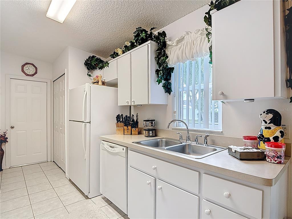 11034 Cranston Street Spring Hill, FL 34608 - Photo 14 of 40 a kitchen with a sink and cabinets