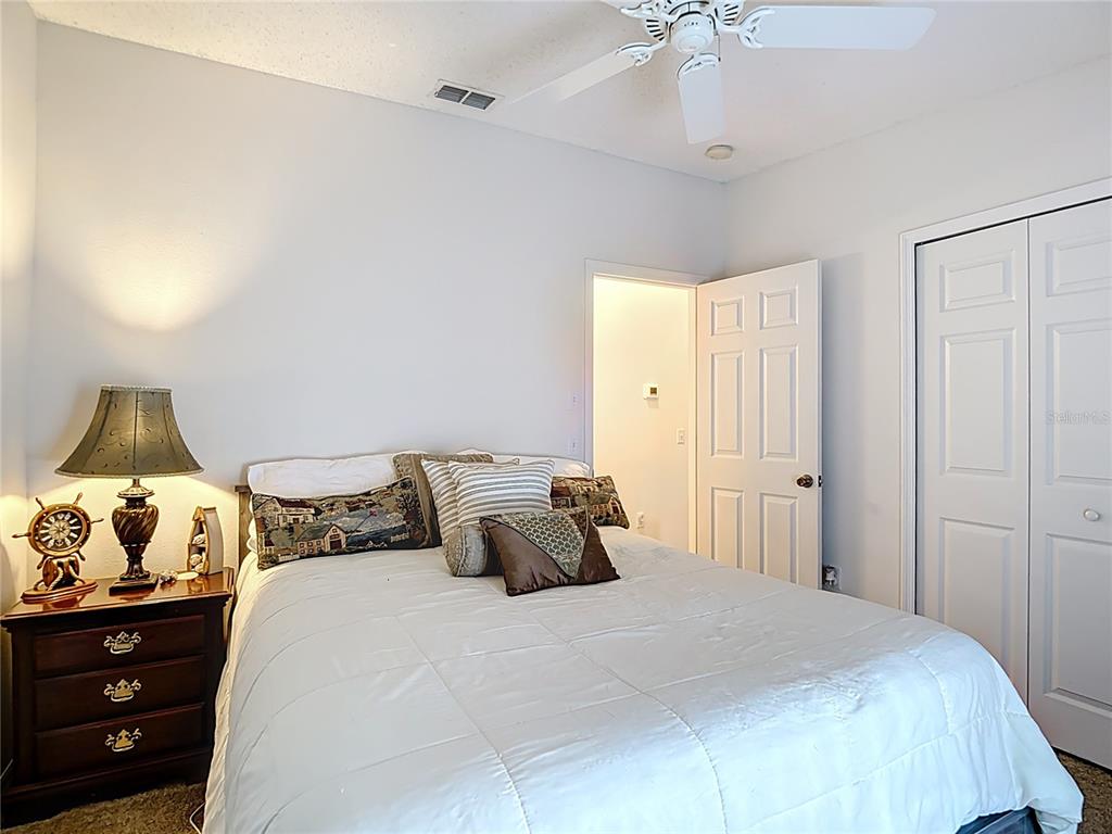 11034 Cranston Street Spring Hill, FL 34608 - Photo 20 of 40 a bedroom with a bed and a window