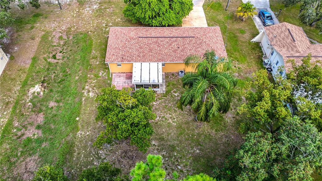 11034 Cranston Street Spring Hill, FL 34608 - Photo 38 of 40 an aerial view of house with yard and outdoor seating