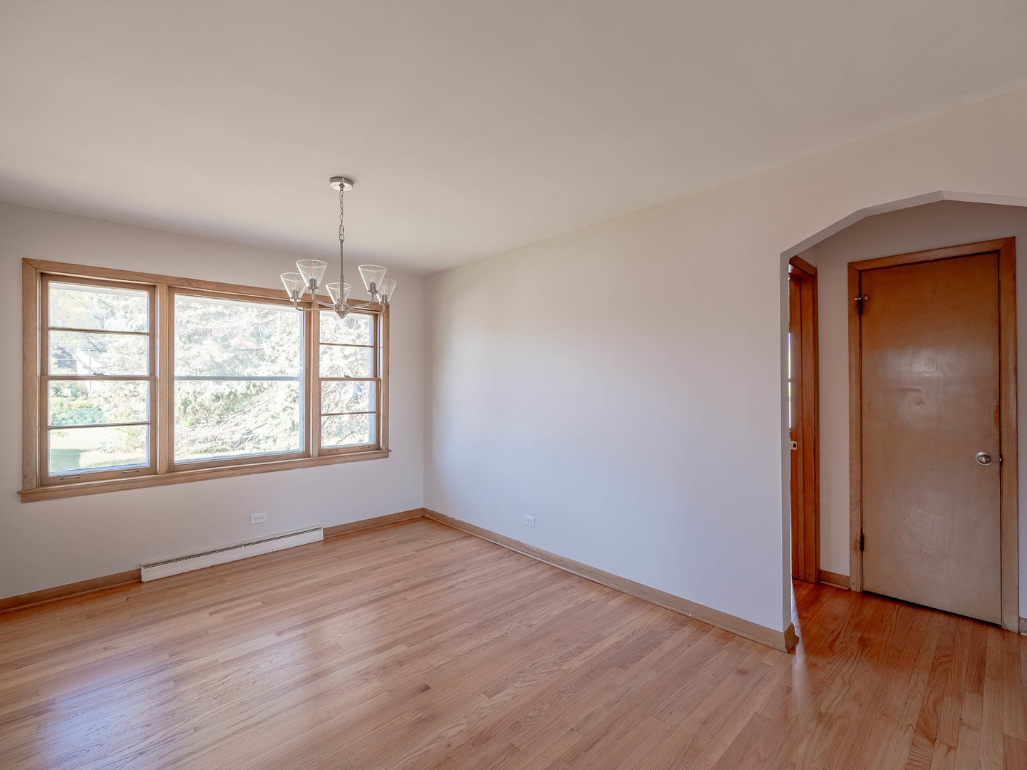 2228 High Ridge Parkway Hillside, IL 60162 - Photo 5 of 12 an empty room with wooden floor and windows