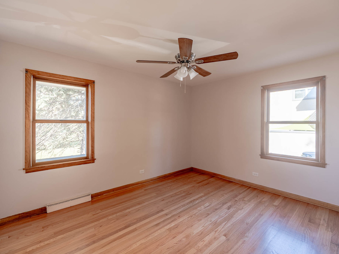 2228 High Ridge Parkway Hillside, IL 60162 - Photo 6 of 12 a view of an empty room with wooden floor and a window