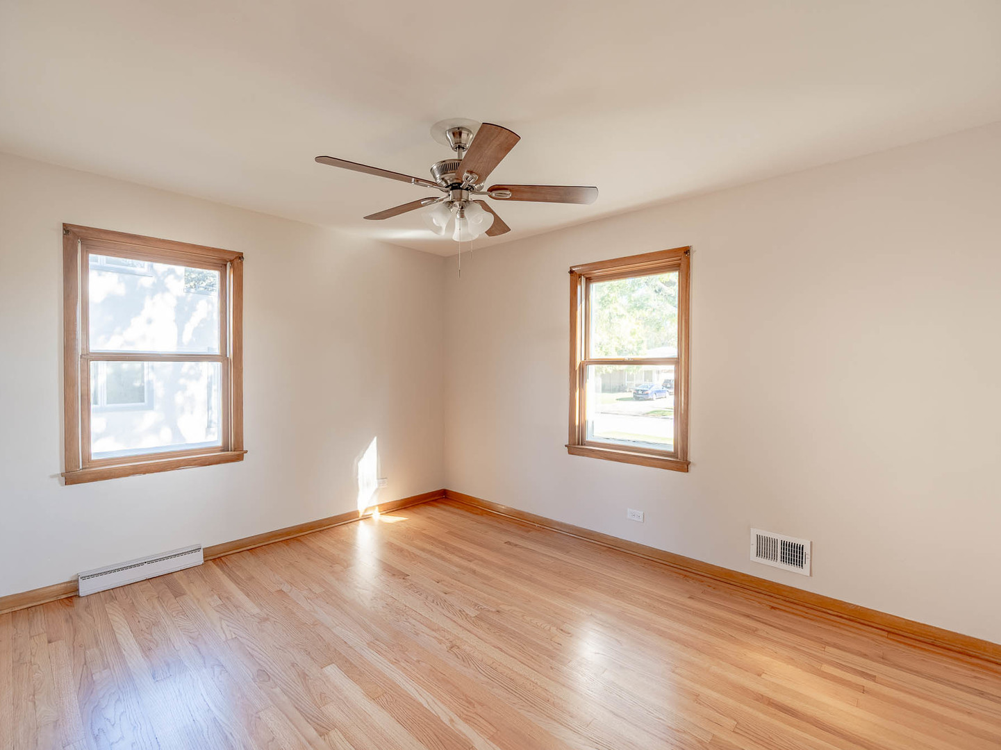2228 High Ridge Parkway Hillside, IL 60162 - Photo 7 of 12 a view of an empty room with wooden floor and a window