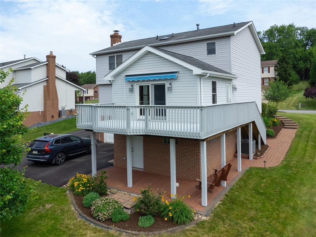 5 Kalyn Court Irwin, PA 15642 - Photo 4 of 40 Wrap around rear deck with Sunsetter awning