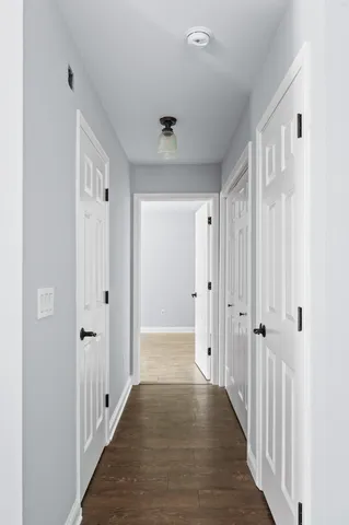 a view of a bathroom with wooden floor