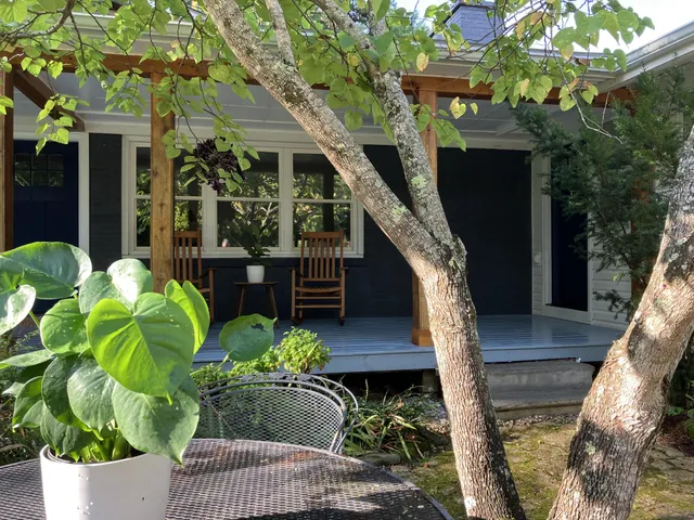 a view of a lounge chair and table in the patio