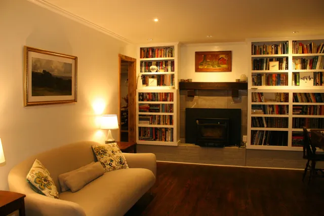 a kitchen with stainless steel appliances kitchen island granite countertop a refrigerator stove and sink