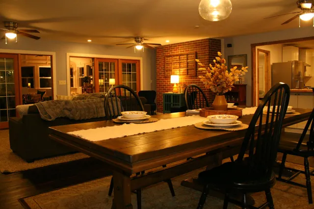 a kitchen with a sink window and cabinets