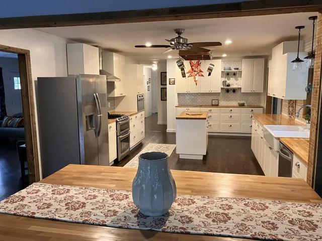 a bathroom with a sink a vanity and a mirror