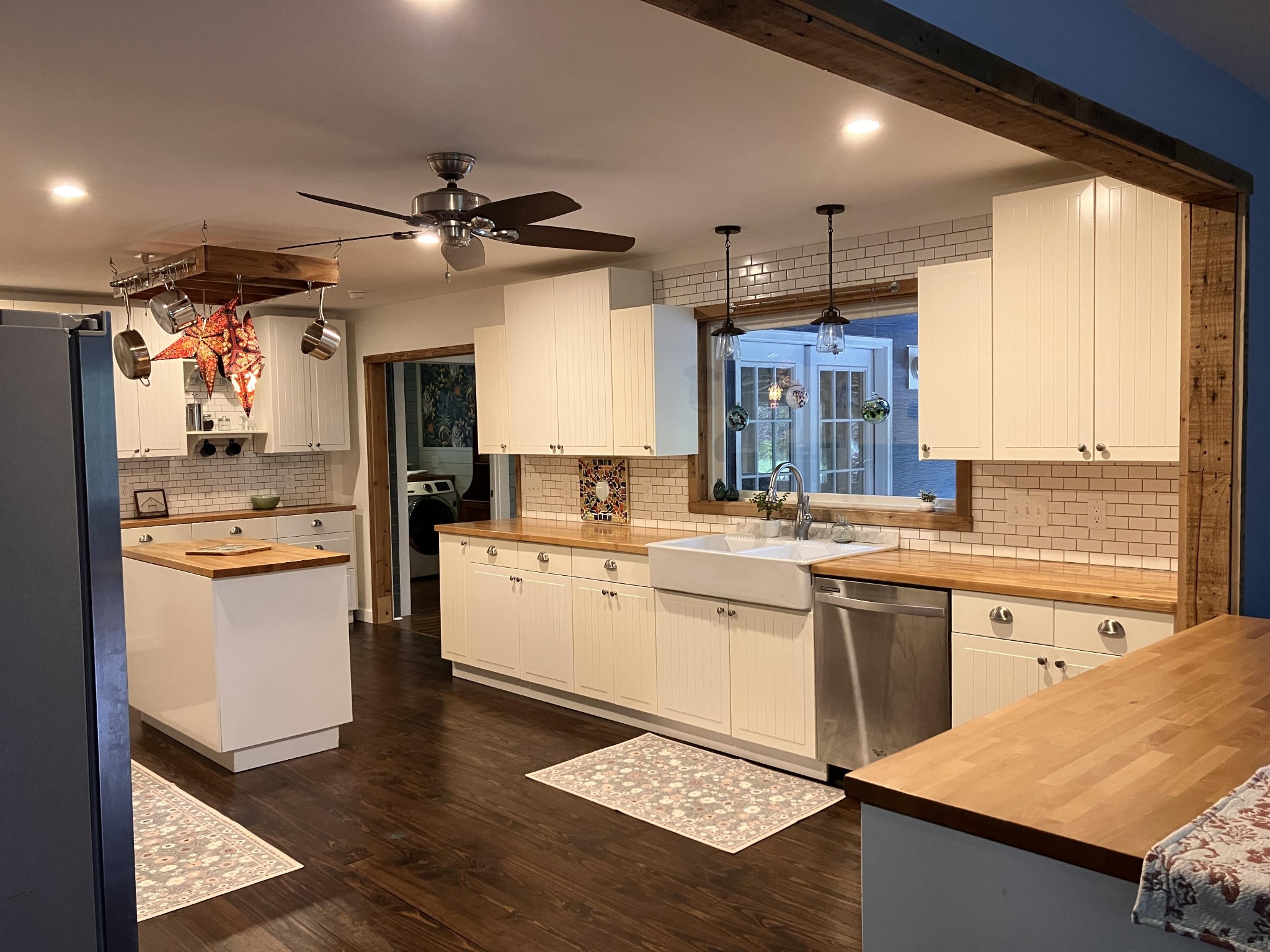 264 Ball Park Road Sewanee, TN 37375 - Photo 26 of 67 a kitchen with a refrigerator a sink dishwasher with a dining table and chairs
