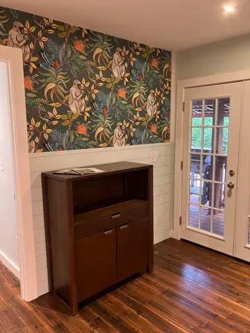 a bathroom with a sink a mirror and a bathtub