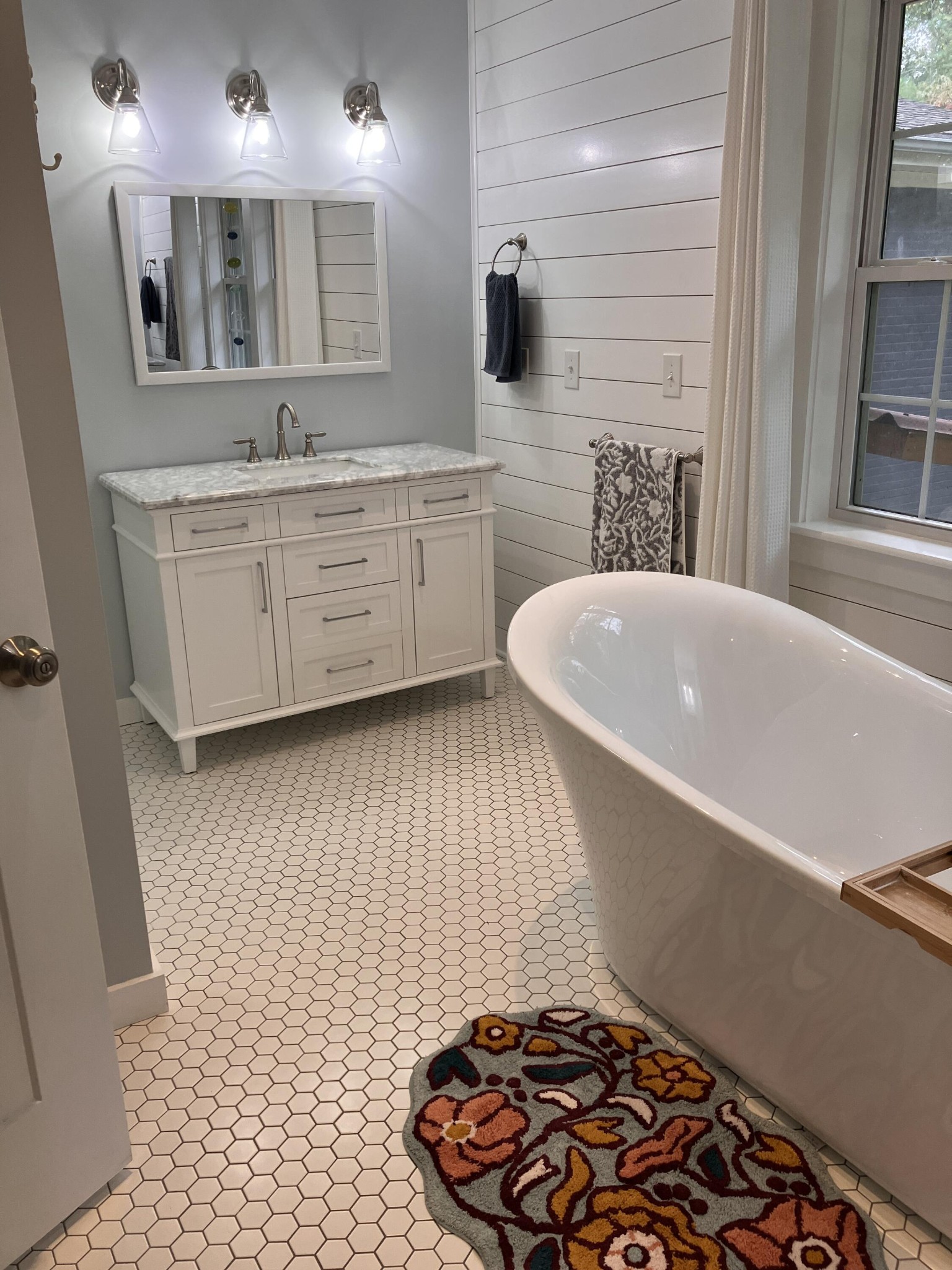 264 Ball Park Road Sewanee, TN 37375 - Photo 51 of 67 a bathroom with a sink a mirror and a bathtub