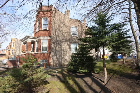 a view of a building with a yard