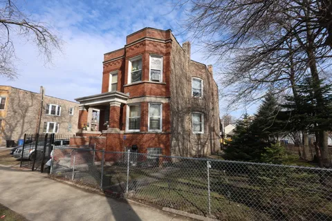 a view of a brick building with many windows