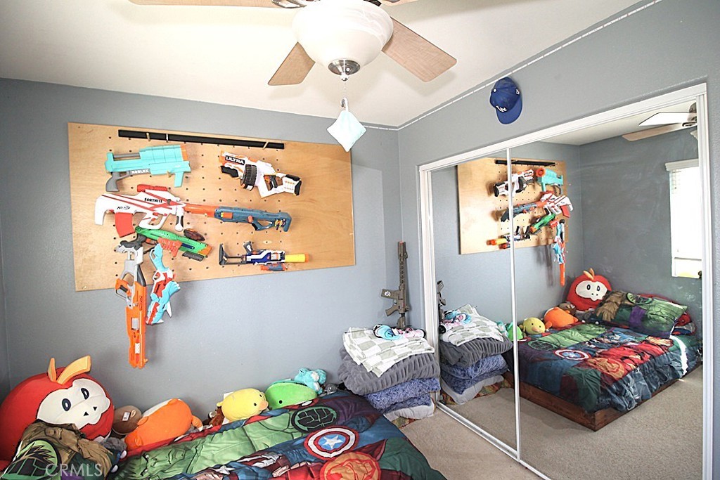 924 Condor Street Barstow, CA 92311 - Photo 30 of 52 a bedroom with toys and a wooden floor