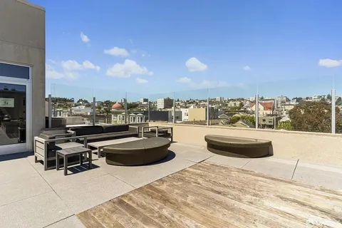 a view of roof deck with patio