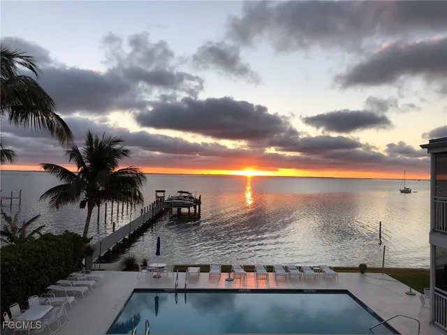 a view of a balcony with chairs