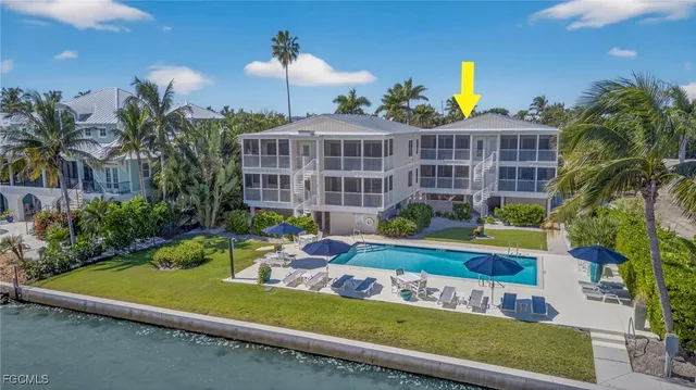 a view of a swimming pool with a patio