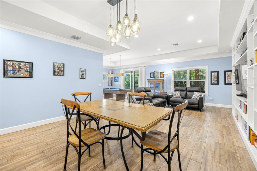 2623 57th Street South Gulfport, FL 33707 - Photo 11 of 50 a view of a dining room with furniture and wooden floor