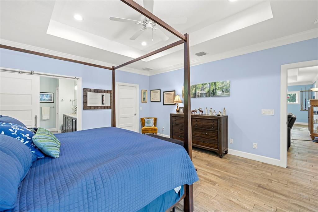 2623 57th Street South Gulfport, FL 33707 - Photo 22 of 50 a bedroom with a bed and a view of kitchen