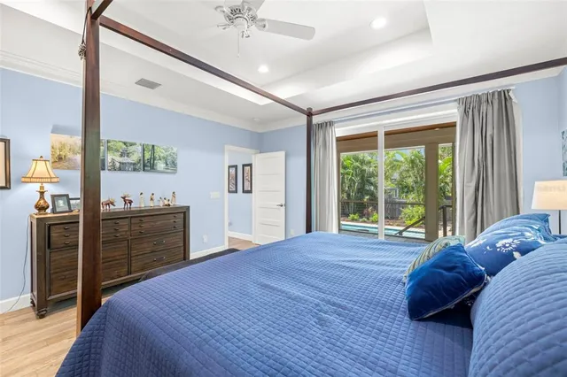 a bed room with a bed and a large window