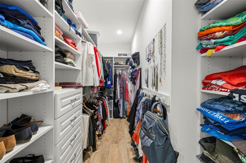 2623 57th Street South Gulfport, FL 33707 - Photo 24 of 50 a view of walk in closet with clothes and shoes