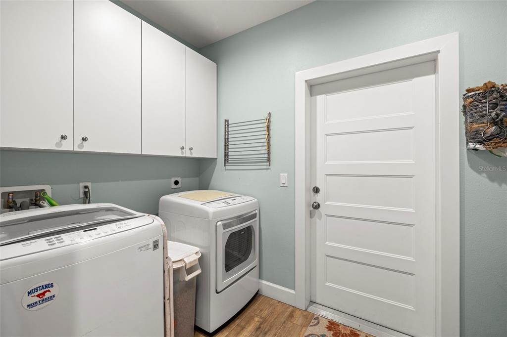 2623 57th Street South Gulfport, FL 33707 - Photo 29 of 50 a view of storage and utility room with washer and dryer