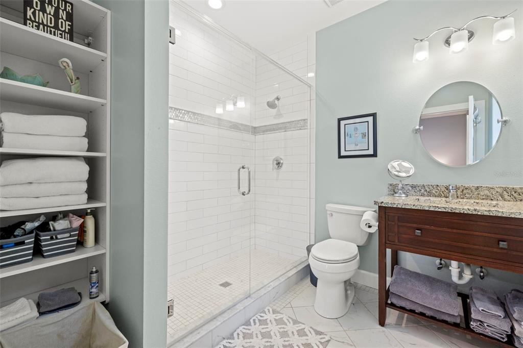 2623 57th Street South Gulfport, FL 33707 - Photo 32 of 50 a bathroom with a toilet a sink and mirror