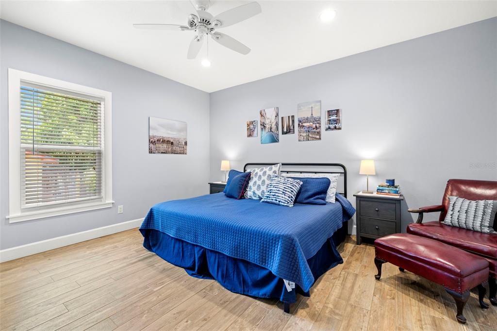 2623 57th Street South Gulfport, FL 33707 - Photo 33 of 50 a bedroom with a bed and a chandelier