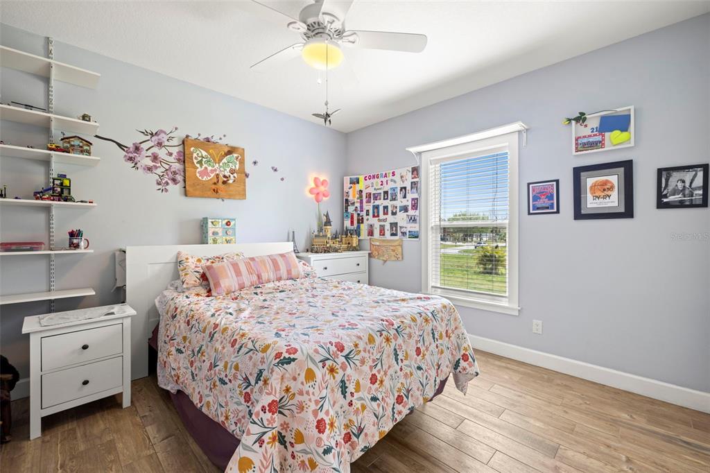 2623 57th Street South Gulfport, FL 33707 - Photo 35 of 50 a bedroom with a bed and a window