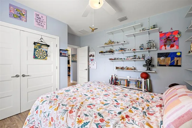 a bedroom with a bed and a cabinets