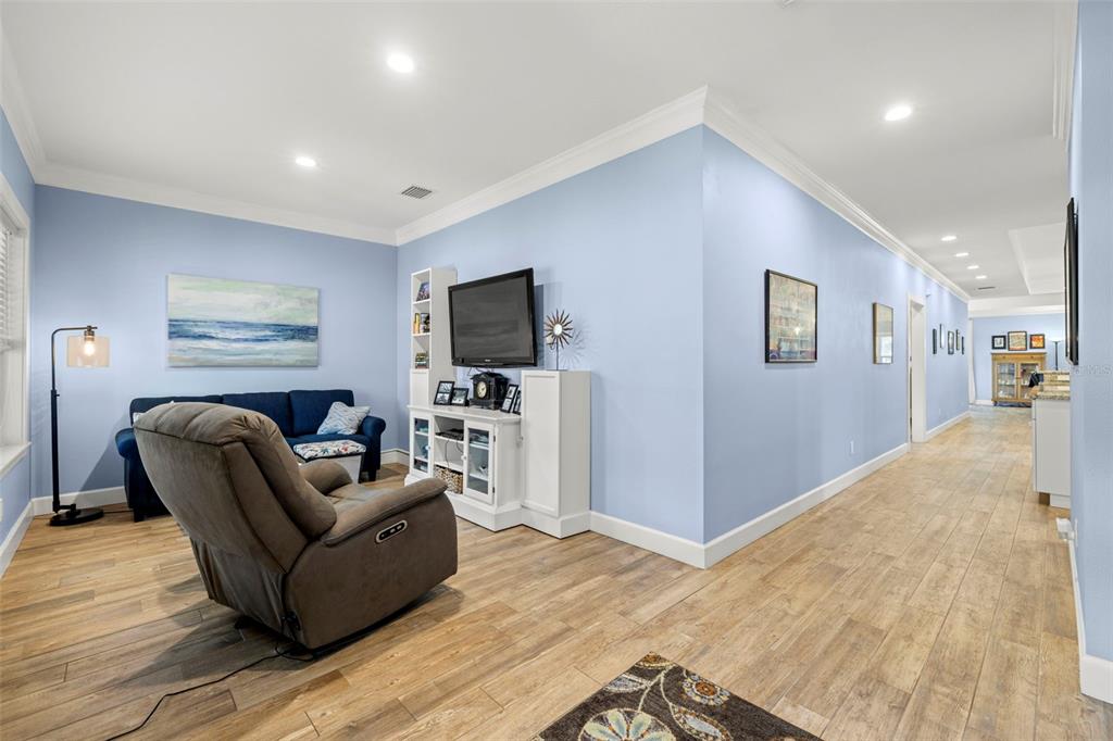 2623 57th Street South Gulfport, FL 33707 - Photo 38 of 50 a living room with furniture and a flat screen tv