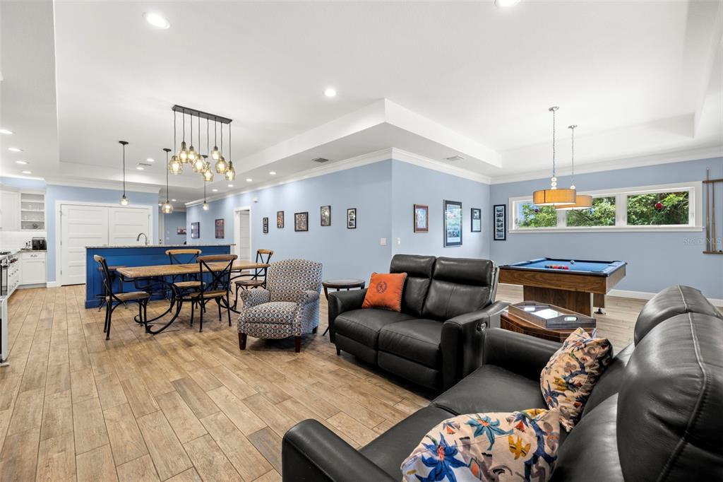 2623 57th Street South Gulfport, FL 33707 - Photo 6 of 50 a living room with furniture and a chandelier