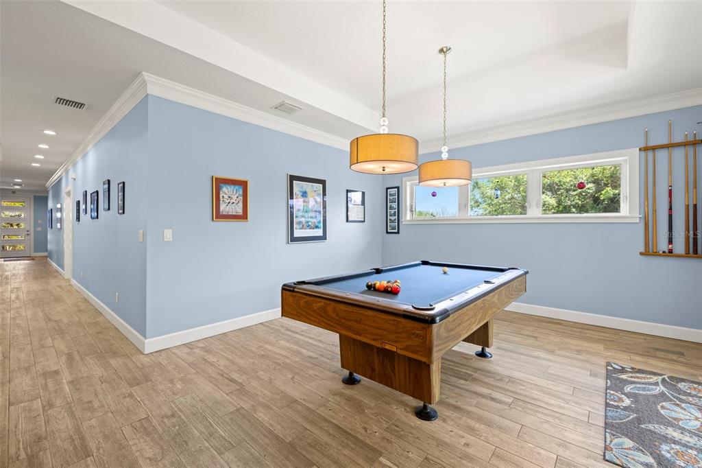 2623 57th Street South Gulfport, FL 33707 - Photo 8 of 50 a room with pool table and windows