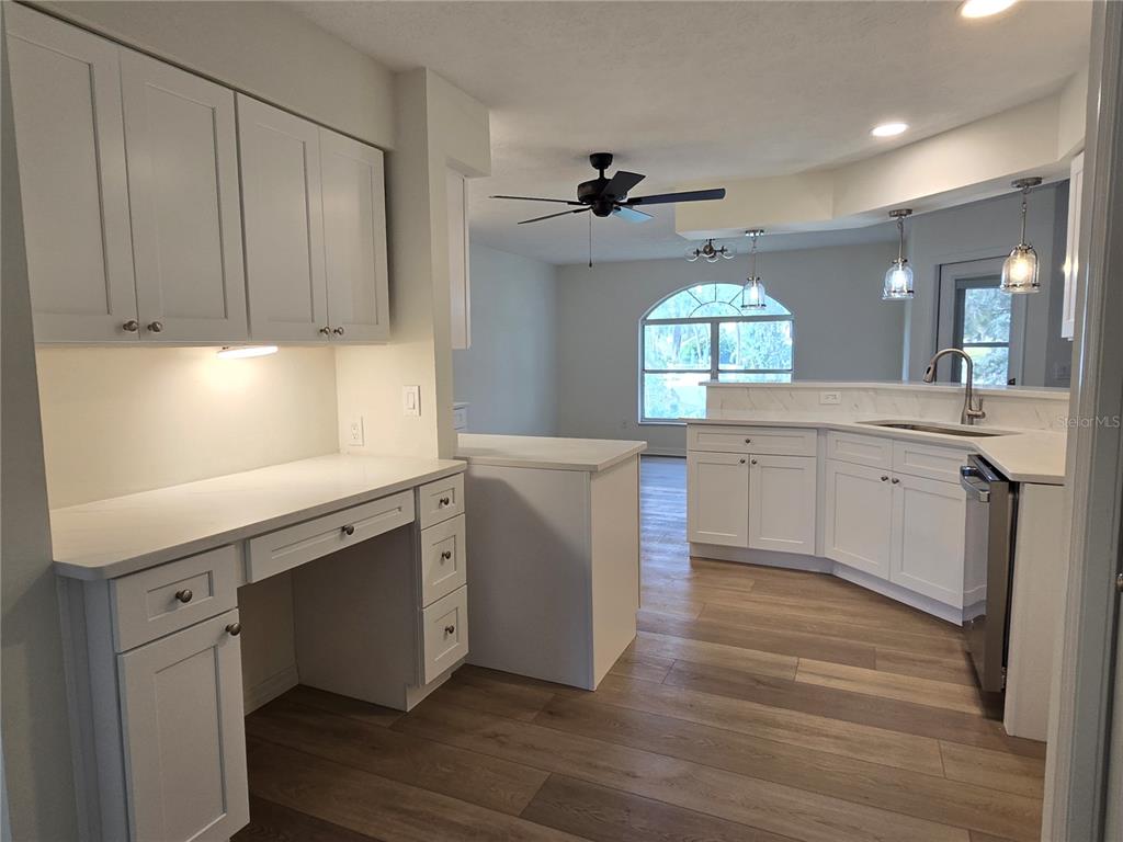 719 Balmoral Court Inverness, FL 34453 - Photo 13 of 29 a kitchen with a cabinets window and wooden floor