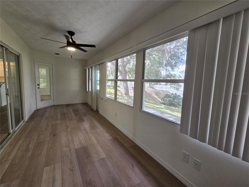 719 Balmoral Court Inverness, FL 34453 - Photo 18 of 29 a view of empty room with wooden floor and fan