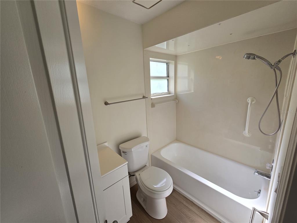 719 Balmoral Court Inverness, FL 34453 - Photo 23 of 29 a white toilet sitting next to a bath tub
