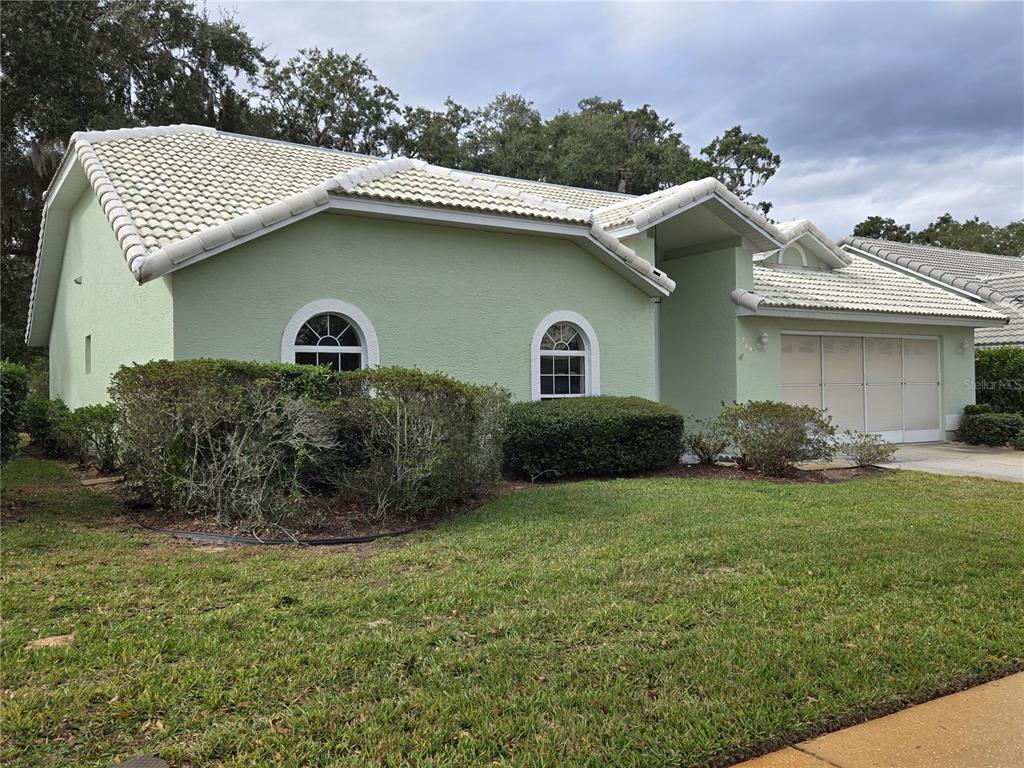719 Balmoral Court Inverness, FL 34453 - Photo 3 of 29 a view of a house with a yard