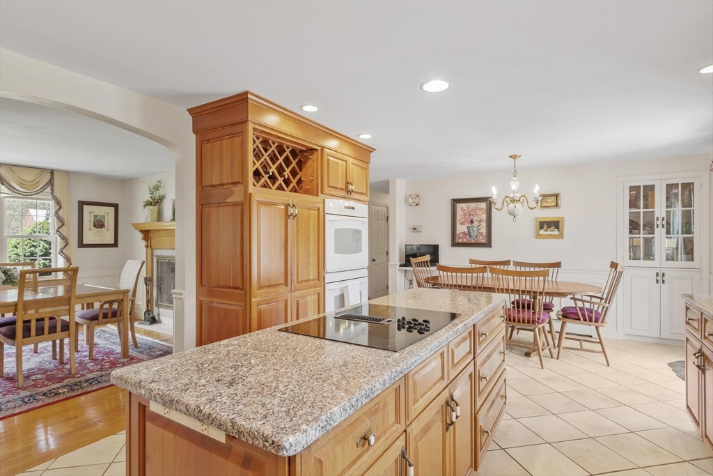 103 Brooks Station Road Princeton, MA 01541 - Photo 11 of 42 a kitchen with a table chairs and wooden floor
